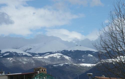 a view of snow covered mountains in the distance at Hotel Serena in Rieti