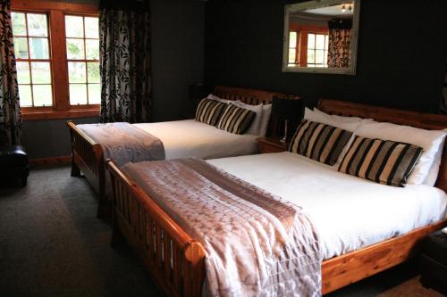 Ένα ή περισσότερα κρεβάτια σε δωμάτιο στο North Kessock Hotel