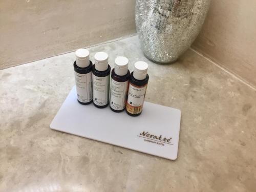 four bottles of medicines sitting on a paper on a counter at Neratze Hammam Suites in Rethymno Town
