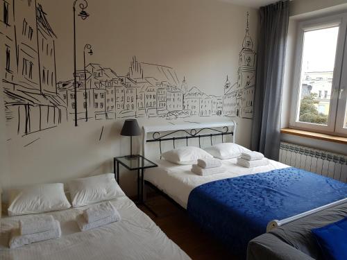 เตียงในห้องที่ Apartment "Femina Cinema" Warsaw City Centre