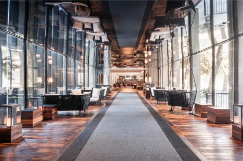 a restaurant with chairs and tables in a building at Hotel Bonaventure Montreal in Montréal