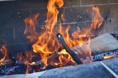 a fire is burning in a brick oven at Casa Rural Finca Paraíso. Heated pool in Vilaflor