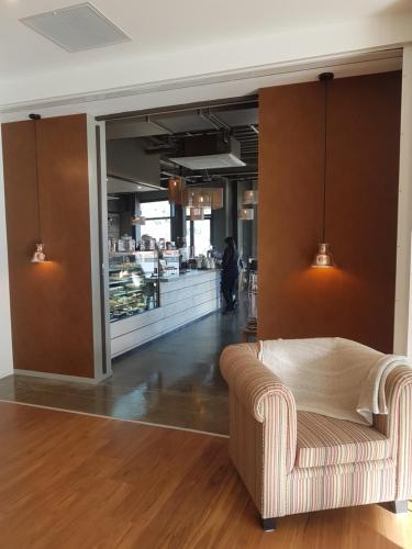 a living room with a couch and a store at Wyndham Garden Remarkables Park Queenstown in Queenstown