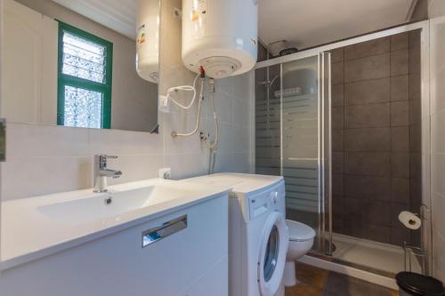 a bathroom with a sink and a toilet at AirCon Los Cristianos, Quiet zone, Chipeque appartment in Arona