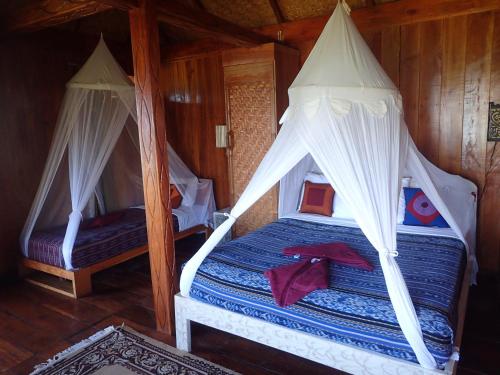 Ліжко або ліжка в номері Waecicu Eden Beach Hotel