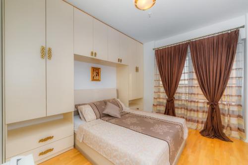 Ένα ή περισσότερα κρεβάτια σε δωμάτιο στο HarMony apartment