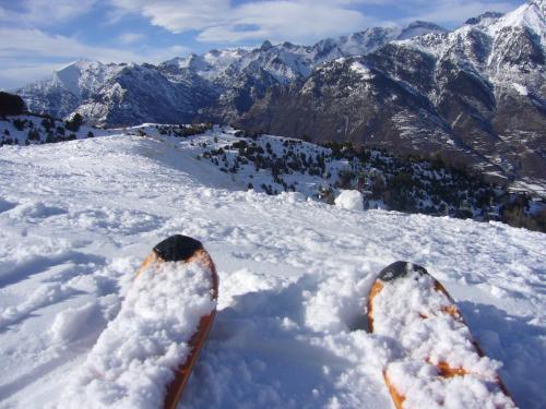a pair of skis in the snow on a mountain at Tres Picos in Eriste