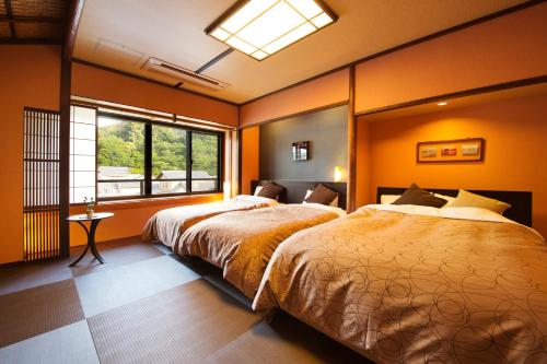 Una cama o camas en una habitación de Kinsuikan