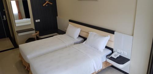 Postel nebo postele na pokoji v ubytování SP hotel