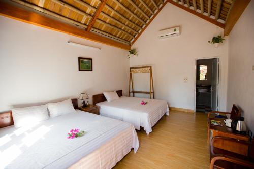 Giường trong phòng chung tại Tam Coc Cozy Homestay