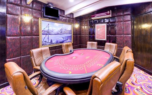 a dining room with a table and chairs at Mayfair Spa Resort & Casino in Gangtok