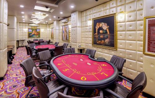a poker room with a poker table and chairs at Mayfair Spa Resort & Casino in Gangtok