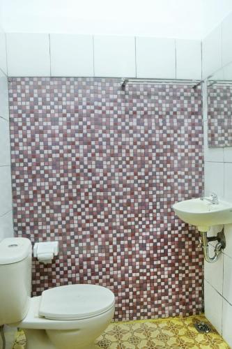 Ванная комната в Badjoeri Ethnic Wooden Homestay