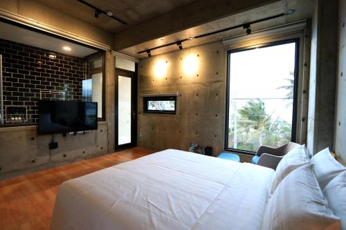 En eller flere senge i et værelse på 墾丁 住在Zhuzai