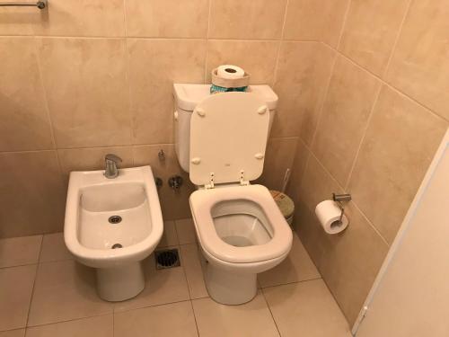 a bathroom with a toilet and a bidet at Amazing Apartament in Buenos Aires