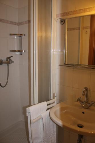 a bathroom with a sink and a mirror at Affittacamere Monica in Monterosso al Mare