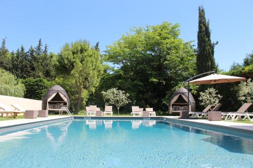 The swimming pool at or close to Le Mas Du Colombier