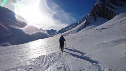 a man is skiing down a snow covered mountain at Brückenhof in Finkenberg