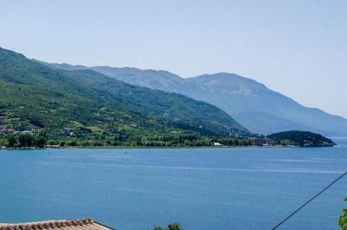 a view of a lake with mountains in the background at Bochkar Guest House in Ohrid