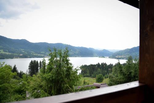 a view of a lake from a window at Casa Edy in Colibiţa