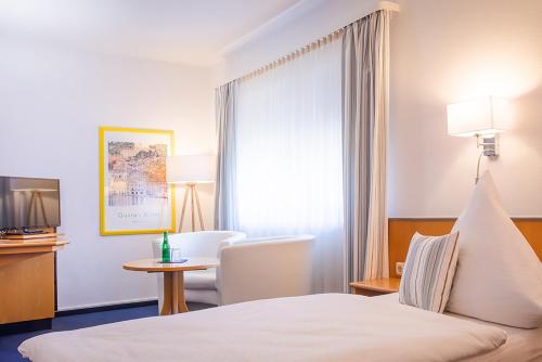 Postel nebo postele na pokoji v ubytování Hotel Lauer