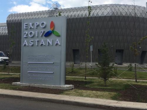 a sign in front of a building at Eco Apart Hotel Astana in Astana