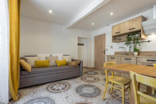 a living room with a couch and a table at Valbonne Flat in Valbonne