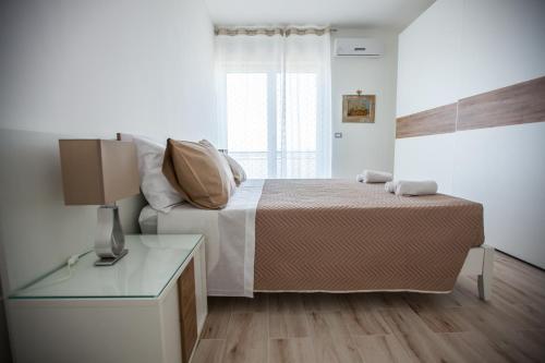 Postel nebo postele na pokoji v ubytování Il Quadrifoglio