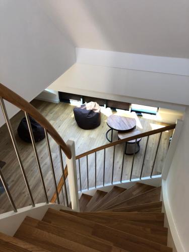 a room with a staircase and a table at Tor zum Meer in Helgoland