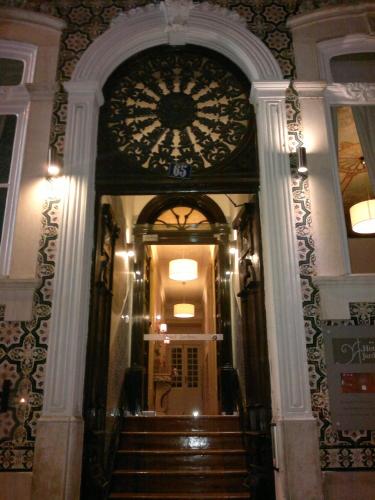 an ornate doorway to a building with a staircase at Hotel Jardim in Coimbra