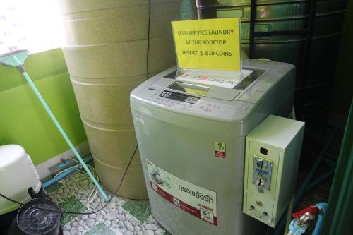 a fax machine with a sign on top of it at i-smile in Chiang Mai