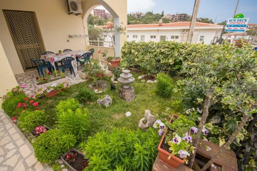 a miniature garden with a fire hydrant in a yard at Apartments Val Maslina in Utjeha