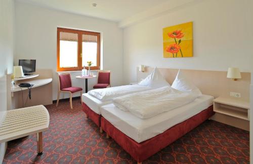 Postel nebo postele na pokoji v ubytování Hotel Quickborn & Gästehaus Hesse