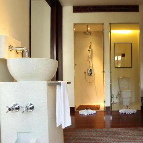 a bathroom with a sink and a toilet at Mai Samui Beach Resort & Spa - SHA Plus in Ban Bang Po