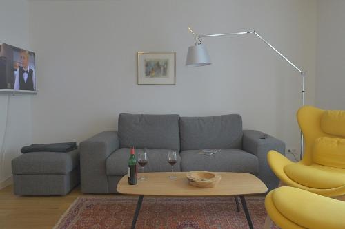 a living room with a couch and a table at Tor zum Meer in Helgoland