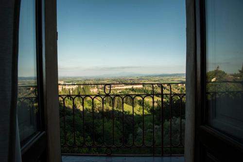 a view from an open door of a balcony at BnB Paolina in Siena