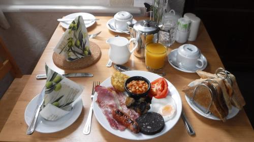 a table with a plate of breakfast food on it at Shearwater in Bridlington