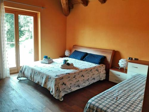 Postel nebo postele na pokoji v ubytování B&B Villa Claudia