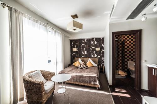 En eller flere senge i et værelse på Apart residences by the sea