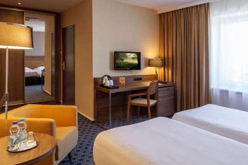Postel nebo postele na pokoji v ubytování Warmiński Hotel & Conference