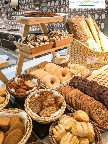 a display of various types of bread and pastries at Santa Monica Suites Hotel in Playa del Ingles