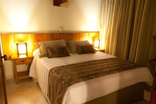Katil atau katil-katil dalam bilik di Refugio do Saci Hotel