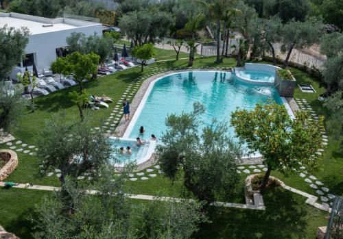 an overhead view of a swimming pool in a resort at Hotel Torre Santamaria Resort in Mattinata