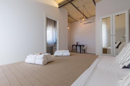 a large bedroom with two white pillows on a bed at Al Faro Bianco B&B e Residence con parcheggio in Vasto