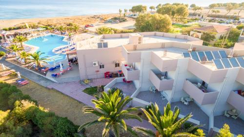 an aerial view of a resort with a swimming pool at Akti Corali Hotel in Amoudara Herakliou