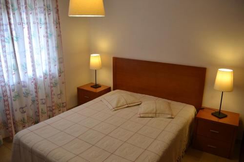 Postel nebo postele na pokoji v ubytování Apartamentos Cabrita