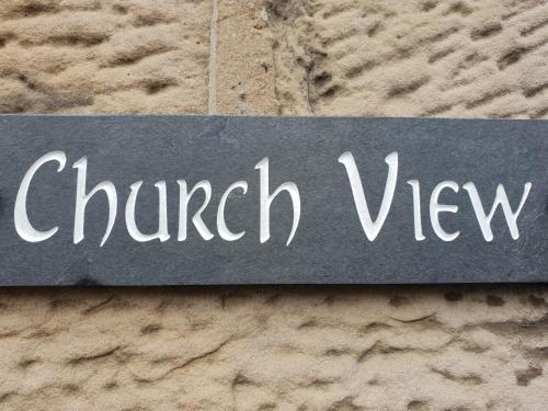 a sign that says church view on a stone wall at Churchview in Townhill