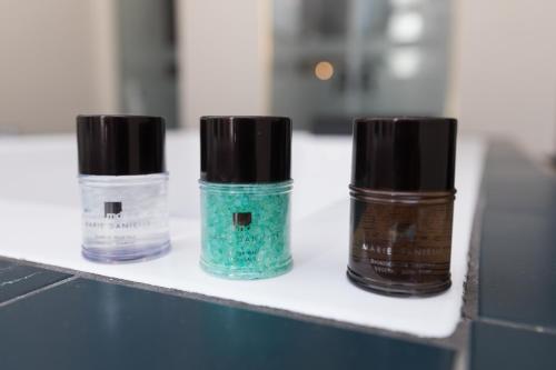 three bottles of nail polish sitting on a counter at Il Salotto della Regina in Naples