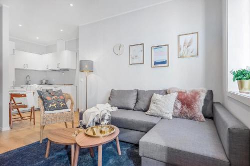 a living room with a couch and a table at NG Apartments in Bergen