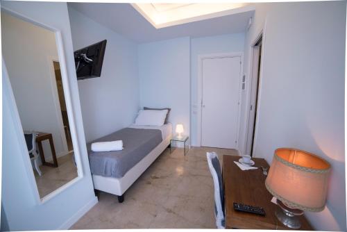 Posteľ alebo postele v izbe v ubytovaní B&B Attico 33